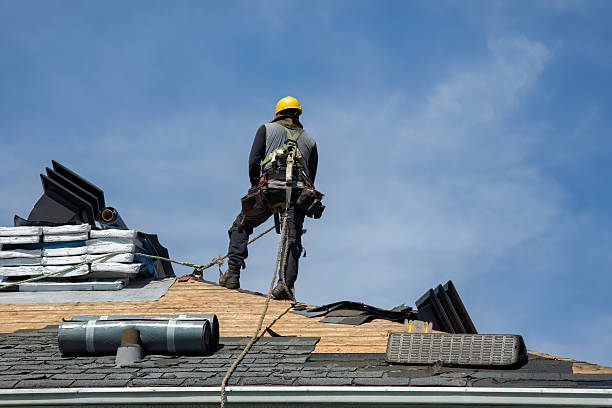 Professional Roof Replacement technician working in Deerfield Beach, FL